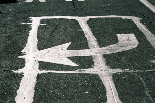 Painted road arrow - photo by Al Belote